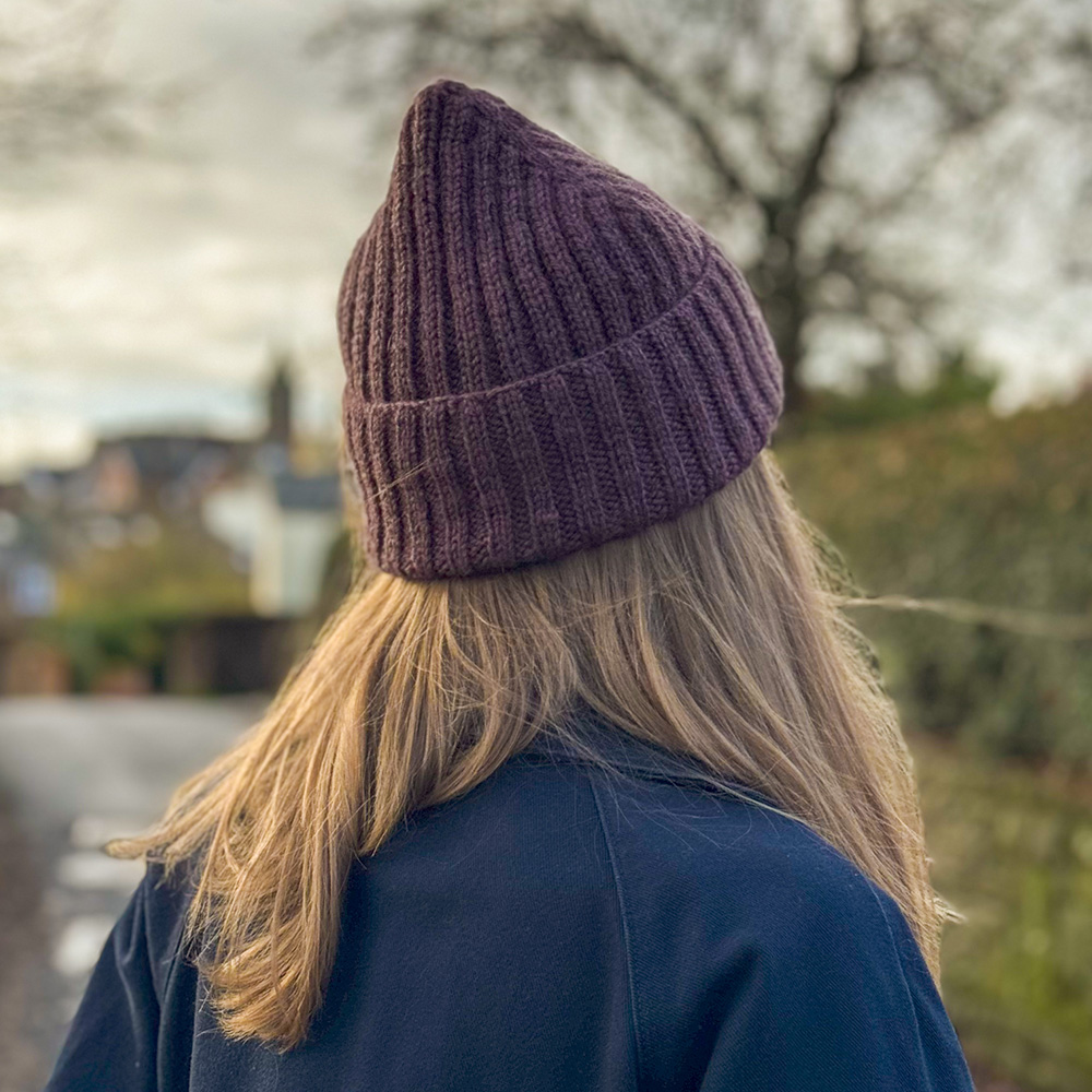 Burrow beanie in the sloe colourway